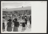 [recto] OUTGOING--Part of crowd at high school prior to departure. ;  Photographer: Aoyama, Bud ;  Heart Mountain, Wyoming.