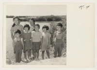 [recto] A group of children living at Camp #5, Bacon Island, Stockton, California, were asked to take a few minutes off ...