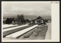 [recto] Japanese farm home, showing typical tomato plant beds. 653 Japanese were evacuated from this valley on the morning after this ...