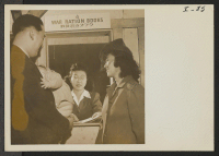 [recto] Mr. and Mrs. Robert Yoshio Kodama and their small son, Junior, are applying for War Ration Books from Fumi Taketa ...