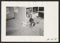 [recto] Nursery school children playing house. ;  Photographer: Stewart, Francis ;  Newell, California.