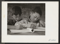 [recto] Sixth grade pupils in the classroom. Miss Mae Hert is the teacher. ;  Photographer: Stewart, Francis ;  Newell, California.