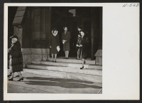 [recto] Church is a Sunday must with many of the young Nisei girls. Here are four girls who have just attended a sermon by Rev. William Clyde Howard, pastor of the Second Presbyterian Church on Michigan Boulevard. ;  Photographer: Mace, Charles E. ;  Chicago,