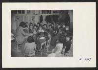 [recto] Story hour in the first grade. Miss Margaret Morrissy. ;  Photographer: Parker, Tom ;  McGehee, Arkansas.