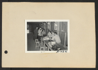 [recto] Poston, Ariz.--(Site #1)-- Shigekawa family from Anaheim, Washington, among the first registrants. ;  Photographer: Clark, Fred ;  Poston, Arizona.