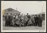 [recto] A group of 19 newspapermen, wire service, and news reel cameramen, and representatives of OWI visited the Tule Lake Relocation Center. This was the first inspection tour granted the press. ;  Photographer: Stewart, Francis ;  Newell, California.