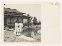 [recto] Here are Mineko Hirasaki of Gilroy in the foreground and her sister Fumiko at the fish pond of the beautiful ...