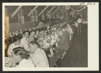 [recto] Part of the group attending the Amache hospital staff banquet. ;  Photographer: McClelland, Joe ;  Amache, Colorado.