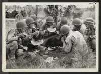 [recto] Time out for watermelon. Many farms within the military area surrounding Camp Shelby were permitted to continue operation. The farmers ...