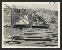 [recto] Site 3. Building erection. ;  Poston, Arizona.