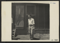 [recto] Manzanar, Calif.--Evacuee of Japanese ancestry at this War Relocation Authority center. ;  Photographer: Lange, Dorothea ;  Manzanar, California.