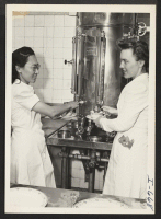 [recto] Miss Machiko Tanaka and Miss Thelma Sydness, administrative dietician at the Iowa Methodist Hospital in the Nutritional Department, are shown ...