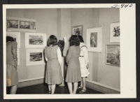 [recto] Students at the New Jersey College for Women, New Brunswick, New Jersey, view an exhibit of paintings and sculpture by ...