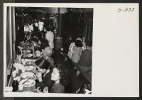 [recto] Dinner time in the converted baggage car. 60 to 70 passengers were served at one time. ;  Photographer: Mace, Charles E. ; , .