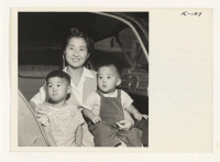 [recto] Mrs. Haruko Kawasaki, recent relocatee from Heart Mountain Center with her two young sons, Victor, 2-1/2, and Allen, 1-1/2 years ...
