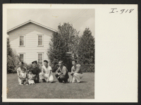 [recto] The Asakawa family is shown on the lawn of their home near Gresham, Oregon. Formerly residents of Hunt, Idaho, the ...
