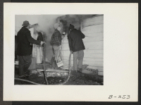 [recto] Quick work, by the evacuee fire department, kept the fire which broke out in the office located at the old hog farm from doing other than minor damage. ;  Photographer: Stewart, Francis ;  Newell, California.