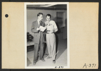 [recto] Poston, Ariz.--Wade Head, project director, with Announcer Chet Huntley of CBS in a nationwide hookup at this War Relocation Authority center for evacuees of Japanese ancestry. ;  Poston, Arizona.