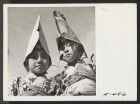 [recto] Two of the Nursery School children who participated in the Harvest Festival Parade held at this relocation center. ;  Photographer: Stewart, Francis ;  Newell, California.