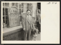 [recto] Mr. William Mori outside the very successful restaurant which he operates at 88 East Main Street, Waterbury, Connecticut. The menu ...