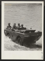 [recto] A crew of the 232nd engineers brings an amphibian ashore after a rapid demonstration crossing of the Leaf River near ...