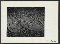 [recto] New Year's Fair. Model of Camp No. 2, which was constructed [by] local craftsmen and on display at the agricultural exhibit. ;  Photographer: Stewart, Francis ;  Poston, Arizona.