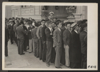[recto] In response to the Army's Exclusion Order No. 20, residents of Japanese ancestry appear at Civil Control Station at 2031 Bush Street, for registration. The evacuees will be housed in War Relocation Authority centers for the duration. ;  Photographer: La