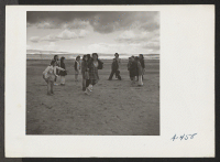 [recto] These girls of the low fifth grade, taught by Mrs. Rhoda McGarva, are here shown playing Two Deep. ;  Photographer: Stewart, Francis ;  Newell, California.