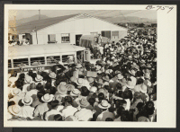 [recto] Large crowd assembled to bid bon voyage to residents of Poston who left the project by bus and truck August 24, 1943, for the Rivers center, on the first lap of the journey to Japan via the Gripsholm, which sailed from an eastern seaport Sept. 1. ;  Pho