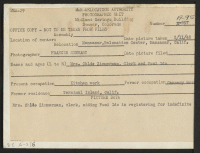 [verso] Mrs. Chlde Zimmerman, clerk, aiding Fumi Ido in registering for indefinite leave. Present occupation: kitchen work. Former occupation: cannery work. Former residence: Terminal Island, Calif. ;  Photographer: Stewart, Francis ;  Manzanar, California.