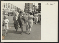 [recto] William Mori (left), owner of the K. and J. Three Decker Restaurant, walks along a busy street in Waterbury, Connecticut, ...
