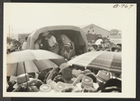 [recto] Occupants of the last bus in convoy get set for the trip to Rivers center on the first lap of their journey to Japan via Gripsholm. ;  Photographer: Brown, Pauline Bates ;  Poston, Arizona.