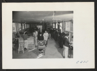 [recto] Interior view of the machine shop. (L to R) Ben D. Ramsdell, Instructor; Junidi Amada, William Tak[...] and Nirosh Uyshara, Assistant Instructors in the Tool Shop. George Ota, Machinist. ;  Photographer: Parker, Tom ;  McGehee, Arkansas.