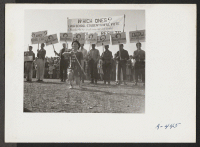 [recto] Part of the High School group that participated in the Harvest Festival Parade at this relocation center. ;  Photographer: Stewart, Francis ;  Newell, California.