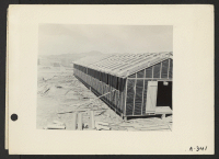 [recto] Poston, Ariz. (Site No. 1)--Partially completed building showing the double roof construction for hot weather protection at this War Relocation Authority Center for evacuees of Japanese ancestry. ;  Photographer: Clark, Fred ;  Poston, Arizona.
