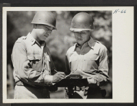 [recto] Captain Nakada, left, in command of the 232nd Engineers composed entirely of Japanese-Americans (both officers and men) is here shown ...