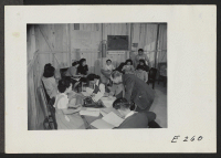 [recto] Interviewers in the Placement Office at this relocation center. W. C. Love is the Placement Officer. ;  Photographer: Parker, Tom ;  Denson, Arkansas.