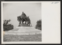 [recto] Monument to the Pioneer Mother, one of the many fine pieces of sculpture to be seen in Kansas City public parks. ;  Photographer: Mace, Charles E. ;  Kansas City, Missouri.