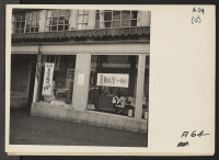 [recto] Shortly before evacuation of persons of Japanese ancestry from the Post and Buchanan Streets neighborhood, San Francisco. This dry goods store is closing out its merchandise. Evacuees will be housed in War Relocation Authority centers for duration. ;  P