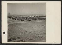 [recto] General view of a section of the Topaz center. White buildings in the background and the hospital, right; administrative buildings, left. ;  Photographer: Parker, Tom ;  Topaz, Utah.