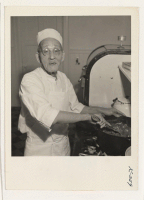 [recto] Mr. Yasu Shirotani is shown working in the kitchen of the Livingstone estate. Mr. Shirotani, who is 77 years old, returned from Topaz four months ago to resume his employment at the Livingstone's where, except for evacuation, he has worked since 1923.
