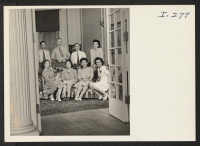 [recto] In the living room of the International Institute, 190 Beacon Street, Boston, where many of the Nisei group meetings have ...