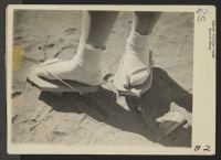 [recto] Manzanar, Calif.--Close-up of geta, stilt-like sandals which are especially useful in dust. These are made by evacuee craftsmen in this War Relocation Authority center. ;  Photographer: Albers, Clem ;  Manzanar, California.