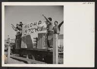 [recto] Residents of block 57, at the Tule Lake Center, wave farewell to friends entraining for other centers. ;  Photographer: Mace, Charles E. ;  Newell, California.