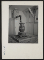 [recto] This picture shows coal stove which is furnished by WRA. ;  Photographer: Stewart, Francis ;  Hunt, Idaho.