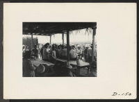 [recto] A view in the lunch shed at the farm. Trucks from the kitchens bring hot lunches to the workers. ;  Photographer: Stewart, Francis ;  Newell, California.
