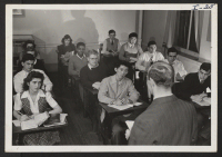 [recto] Mathematics class in the Swarthmore, Pennsylvania, High School includes (center row front) Jessie Hiraoka, National Honor Society member and champion ...