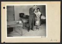 [recto] Poston, Ariz.--Florence Mori, evacuee of Japanese ancestry at this War Relocation Authority center, with Mr. Huntley of the CBS in a nationwide hookup. ;  Photographer: Clark, Fred ;  Poston, Arizona.