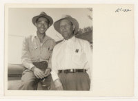 [recto] Mr. Harvey Whitton, owner and operator of the Whitton Ranch, Wheatland, California, is shown with his able foreman Ted Okimoto, formerly of Granada. ;  Photographer: Iwasaki, Hikaru ;  Wheatland, California.