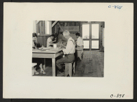 [recto] Manzanar, Calif.--In the Art School at this War Relocation Authority center for evacuees of Japanese ancestry. ;  Photographer: Lange, Dorothea ;  Manzanar, California.